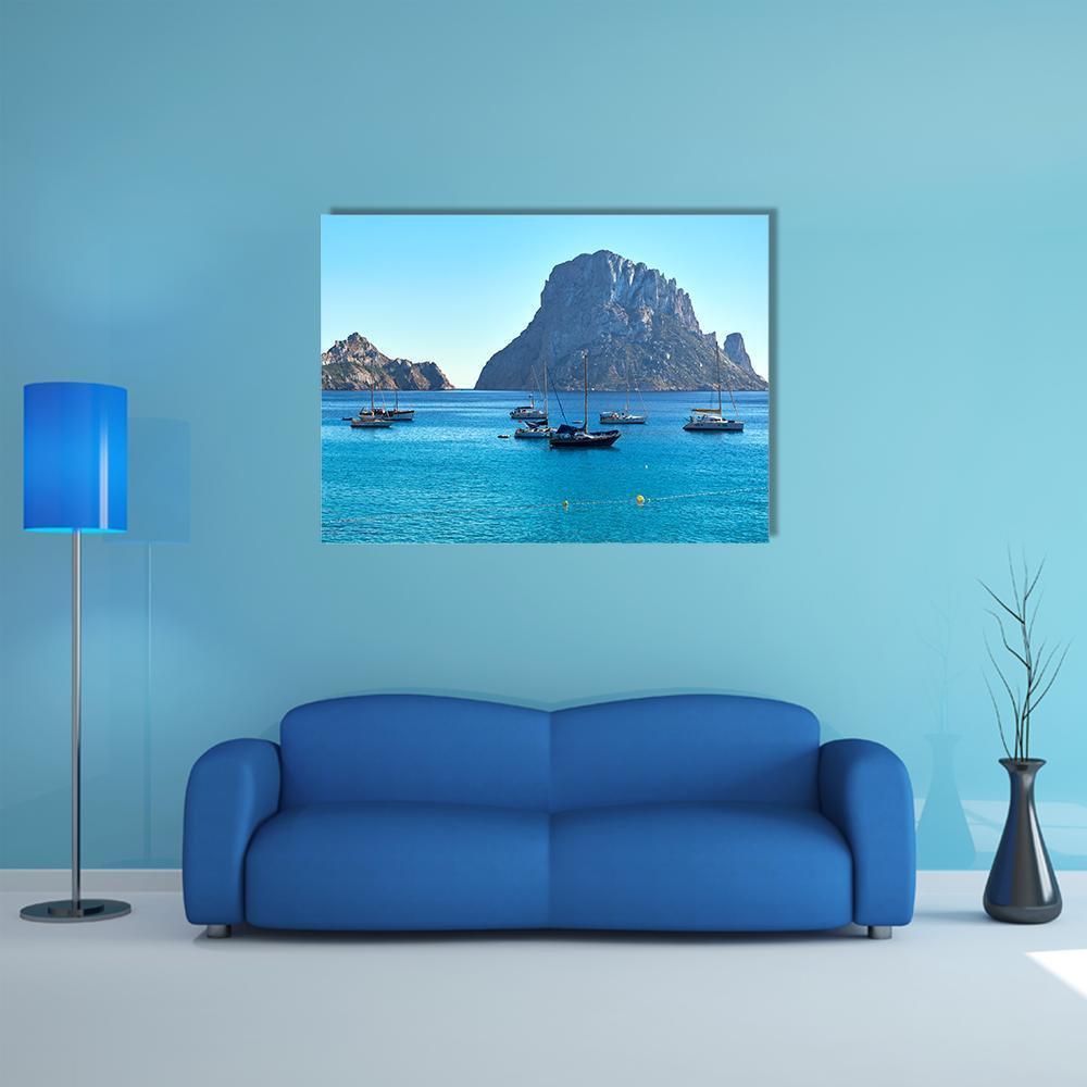 Es Vedra Island Canvas Wall Art in gray and blue, single panel hung on a wall
