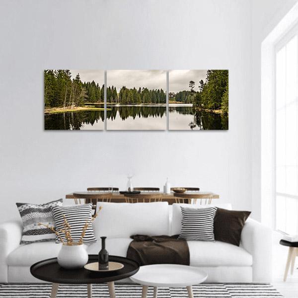 Mystery Lake and Pine Forest Panoramic Canvas Wall Art in white, gray and green, hung on a wall