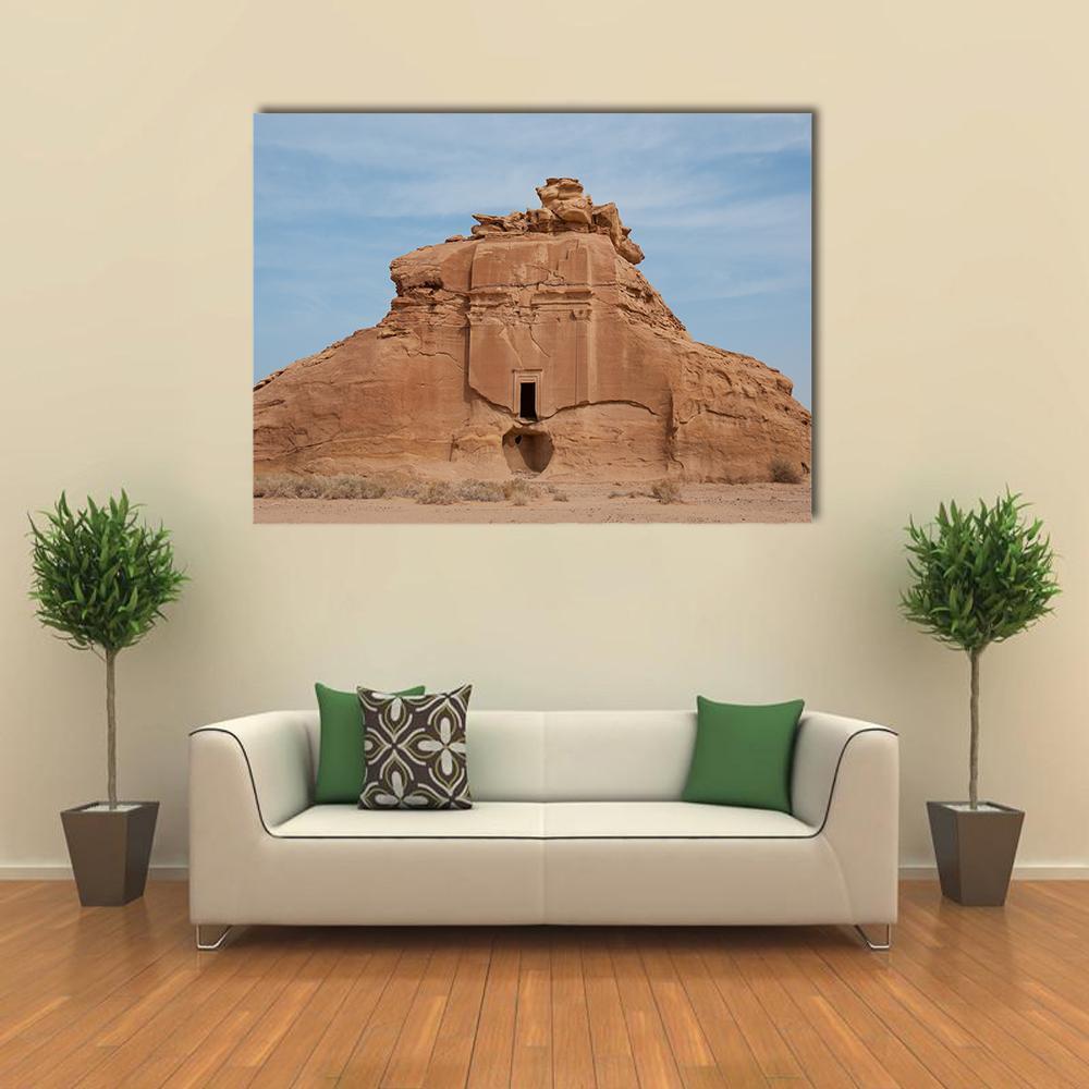 Nabataean Rock Tomb Canvas Wall Art in beige, brown and blue, single panel hung on a wall