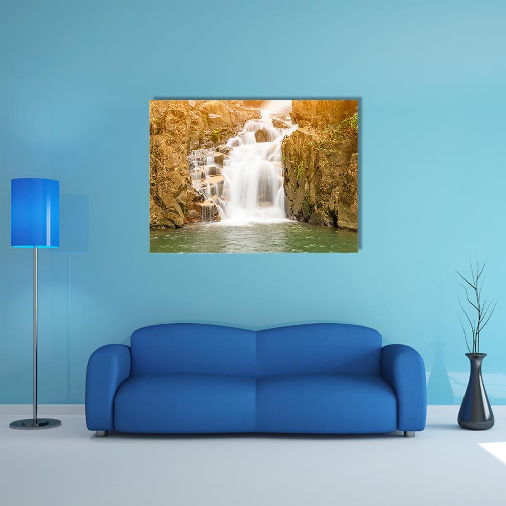 Namtok Phlio Waterfall Canvas Wall Art in white, brown and green, single panel hung on a wall