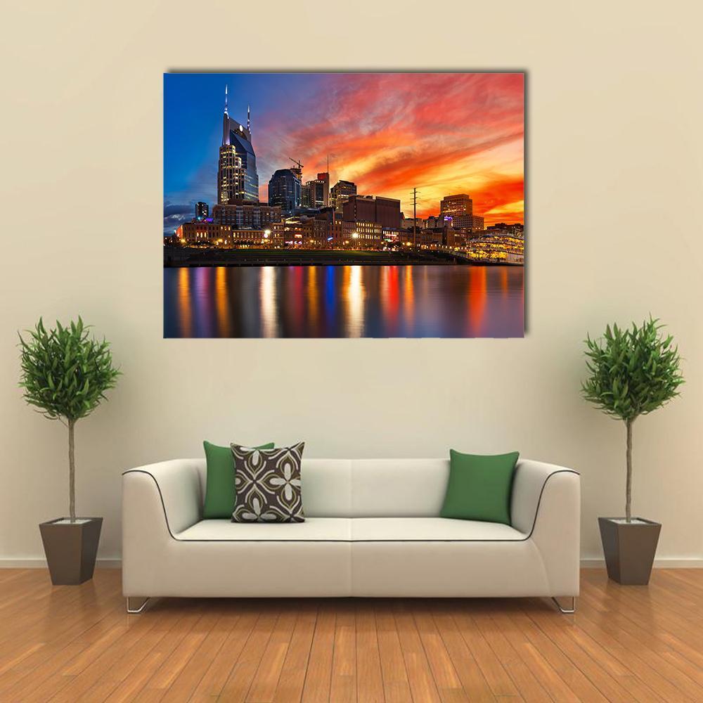 Nashville Skyline at Sunset Canvas Wall Art in orange, yellow and blue, single panel hung on a wall