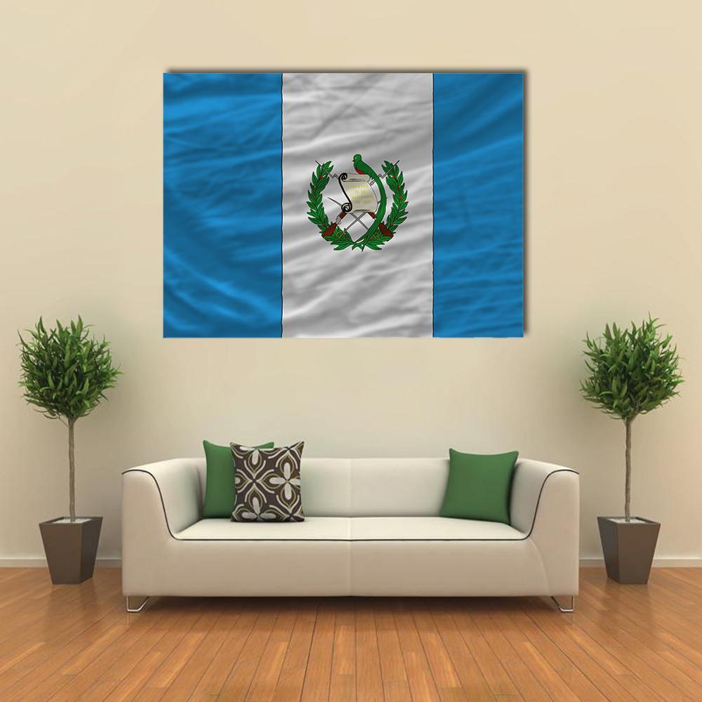 Flag of Guatemala with Coat of Arms Canvas Wall Art in white and blue, single panel hung on a wall