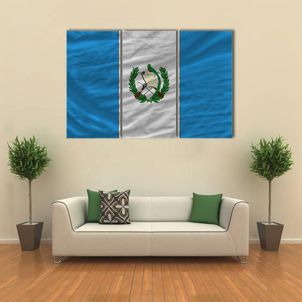 Guatemala Flag with Coat of Arms Canvas Wall Art in white and blue, 3 panel horizontal set hung on a wall