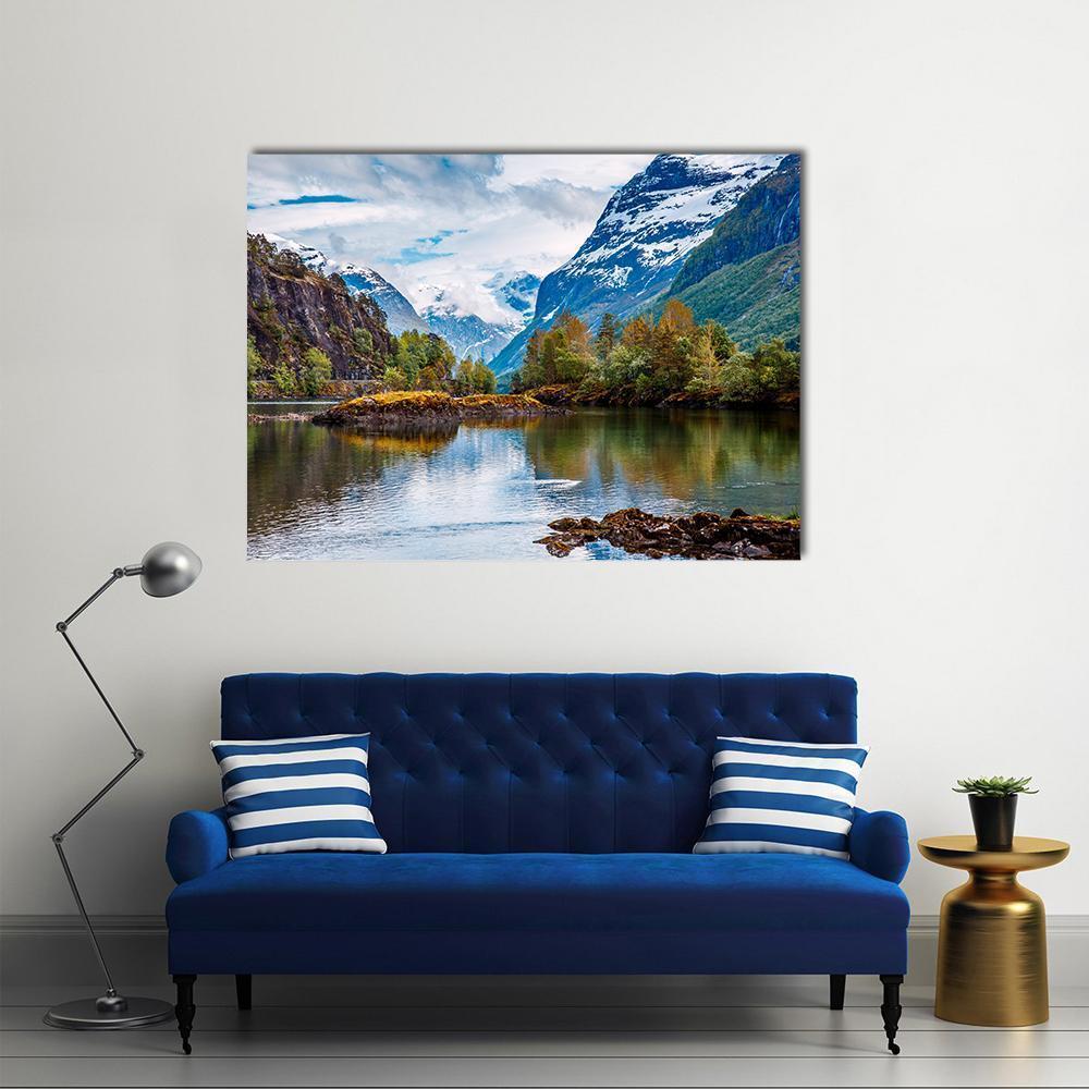 Norwegian Lake with Snow-capped Mountains Canvas Wall Art in white, green and blue, single panel hung on a wall