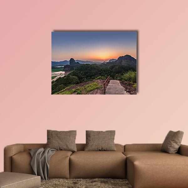 Longhushan Landscape at Sunset Canvas Wall Art in orange, green and blue, single panel hung on a wall