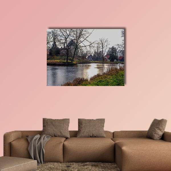 Sunlit Frozen Stream in Germany Canvas Wall Art in gray, brown and green, single panel hung on a wall