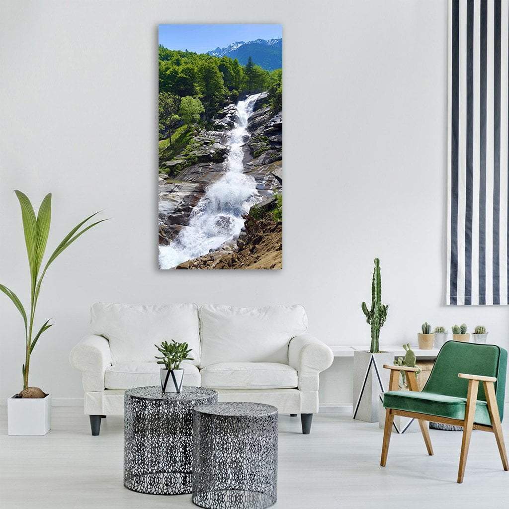 Snow-capped Mountain Stream and Waterfall Vertical Canvas Wall Art in white, green and blue, single vertical panel hung on a wall