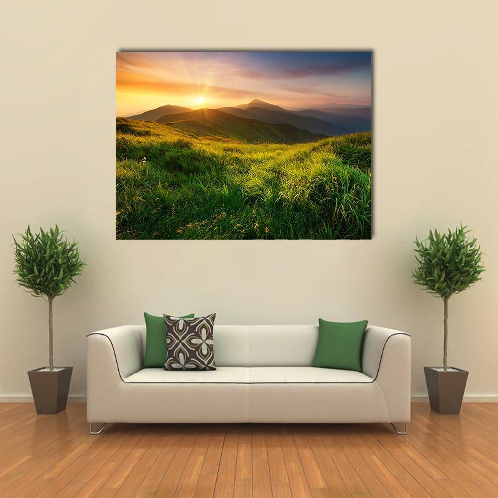 Mountain Valley During Sunrise Canvas Wall Art in orange, yellow and green, single panel hung on a wall