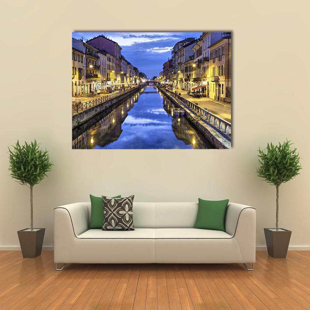 Naviglio Grande Canal Evening Reflections Canvas Wall Art in gold, yellow and blue, single panel hung on a wall