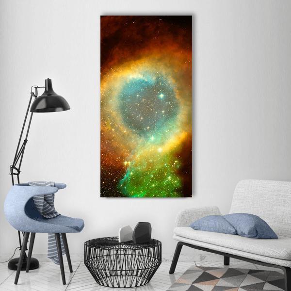 Nebula and Star Field Vertical Canvas Wall Art in orange, yellow and blue, single vertical panel hung on a wall