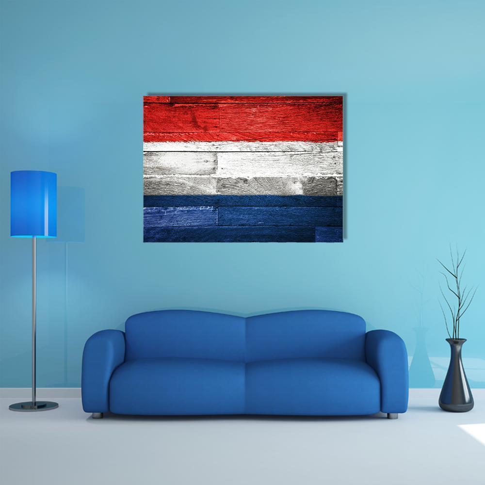 Netherlands Flag on Weathered Wood Canvas Wall Art in white, red and blue, single panel hung on a wall