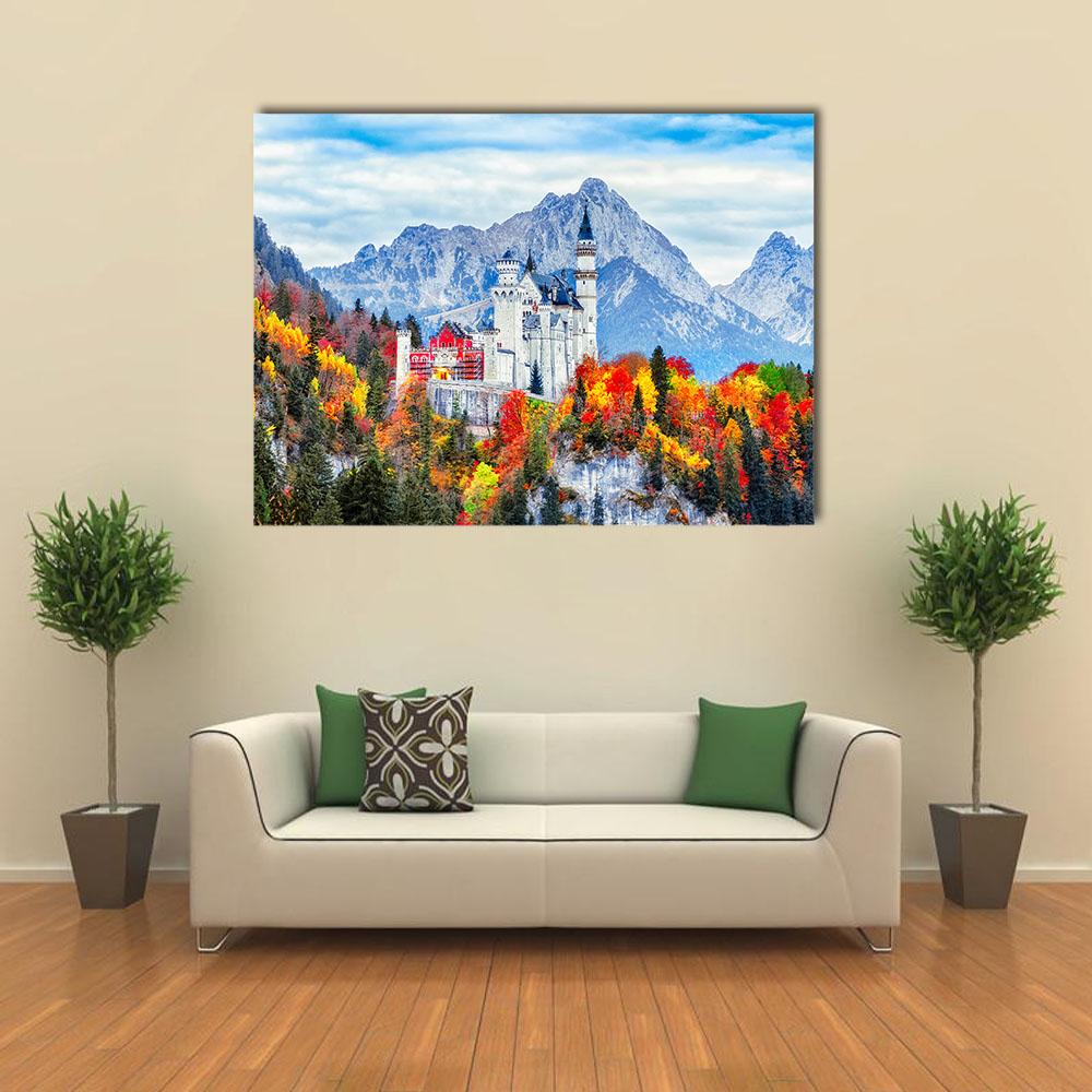 Neuschwanstein Castle with Autumn Foliage Canvas Wall Art in orange, green and blue, single panel hung on a wall