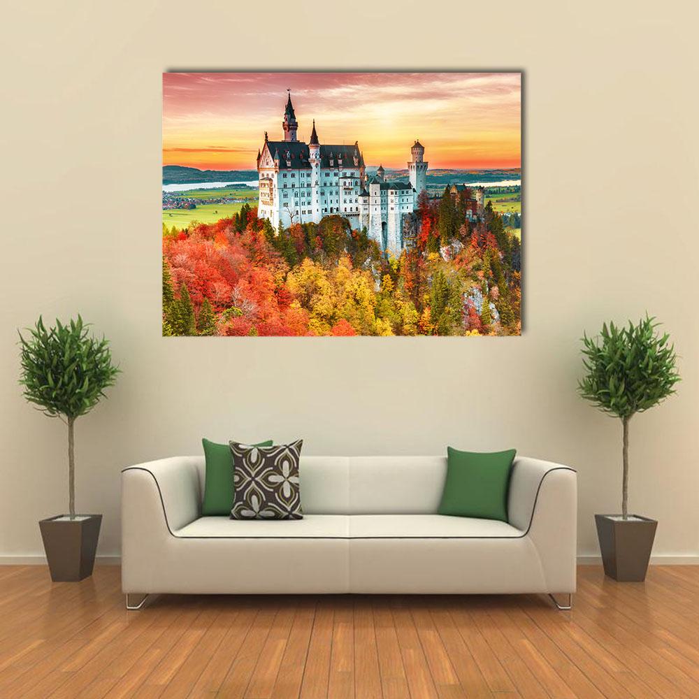 Neuschwanstein Castle in Autumn Canvas Wall Art in orange, yellow and green, single panel hung on a wall