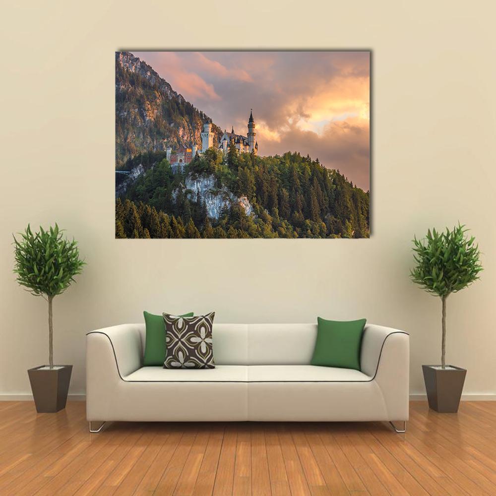 Neuschwanstein Castle at Sunset, Germany Canvas Wall Art in orange, green and pink, single panel hung on a wall