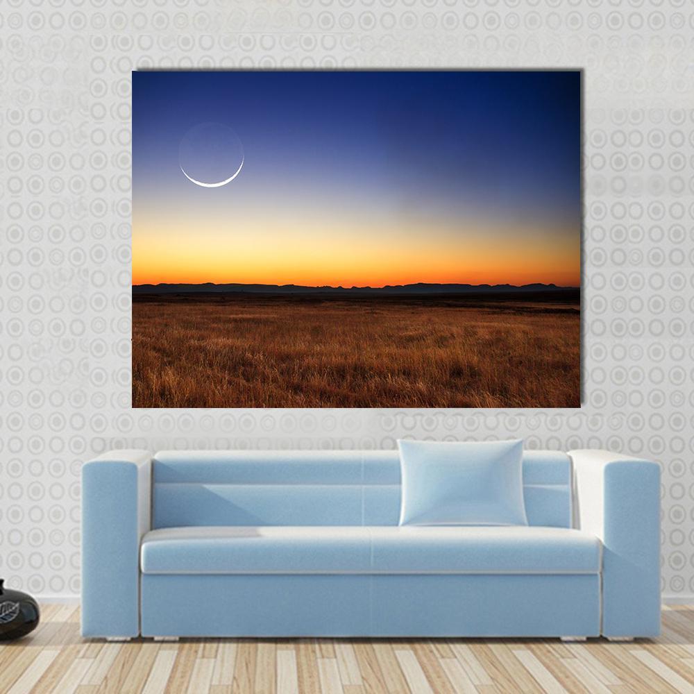 New Moon at Sunset Canvas Wall Art in brown, orange and blue, single panel hung on a wall