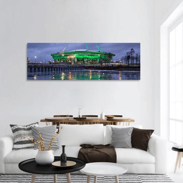 Krestovsky Island Stadium at Night Panoramic Canvas Wall Art in black, green and blue, hung on a wall