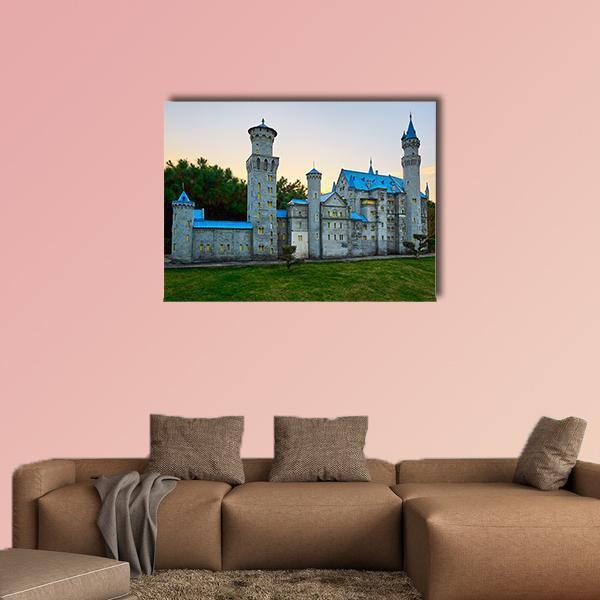 Swan Stone Castle at Twilight Canvas Wall Art in gray, green and blue, single panel hung on a wall