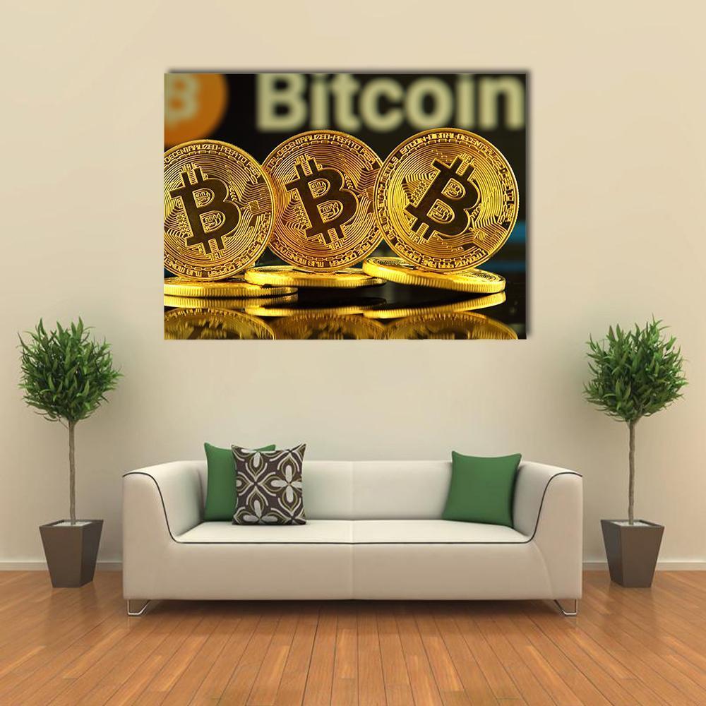 Three Gold Bitcoins with Modern Typography Canvas Wall Art in black, gold and yellow, single panel hung on a wall