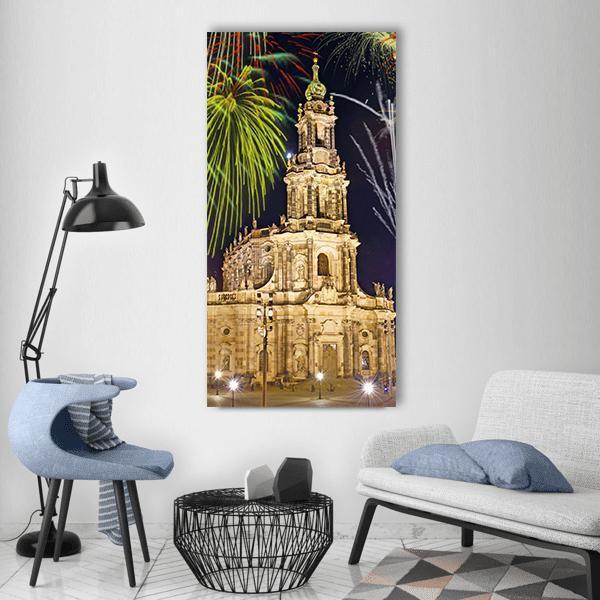 Dresden Fireworks Over Baroque Cathedral Vertical Canvas Wall Art in black, gold and yellow, single vertical panel hung on a wall