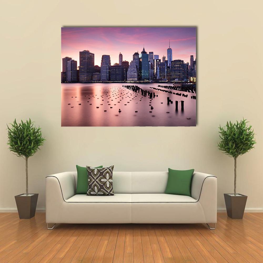 Manhattan Skyline at Twilight Canvas Wall Art in blue, purple and pink, single panel hung on a wall