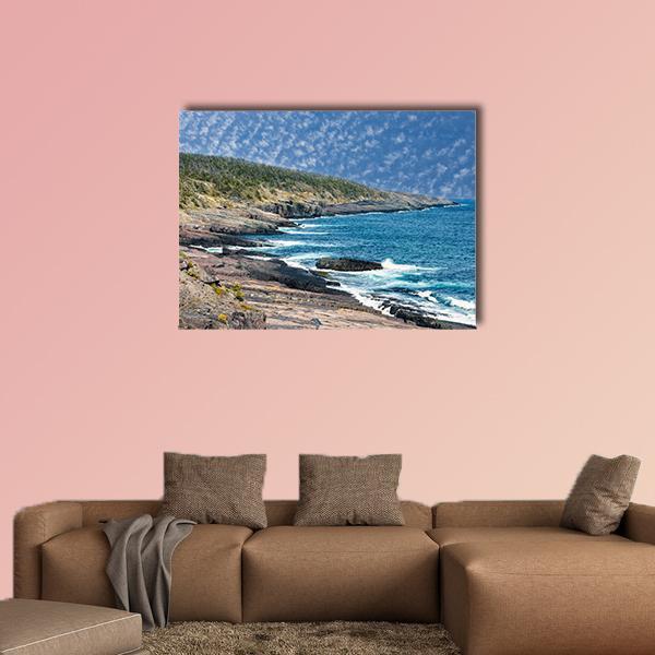 Newfoundland Rocky Shore with Crashing Waves Canvas Wall Art in gray, brown and blue, single panel hung on a wall
