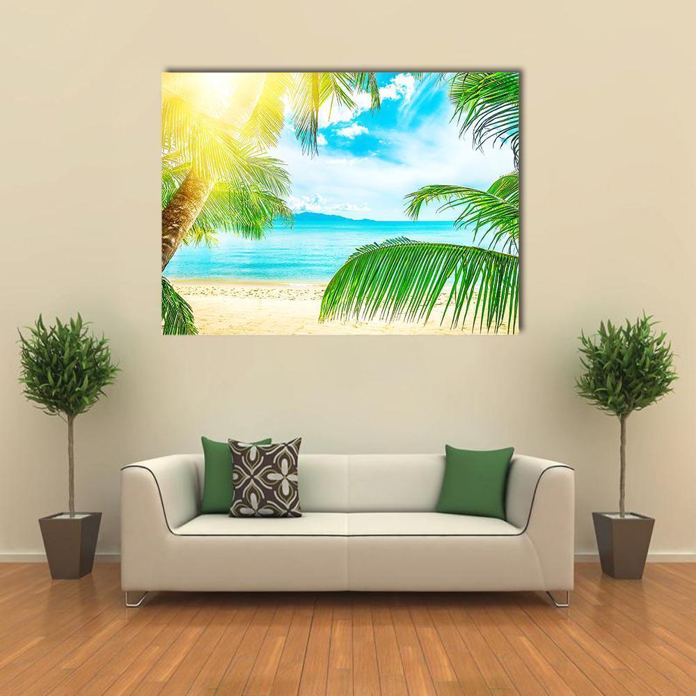Tropical Beach with Palm Trees Canvas Wall Art in yellow, green and blue, single panel hung on a wall