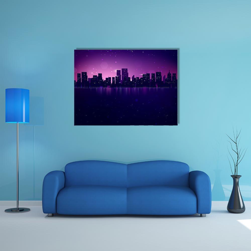 Night City Skyline with Waterfront Glow Canvas Wall Art in blue, purple and pink, single panel hung on a wall