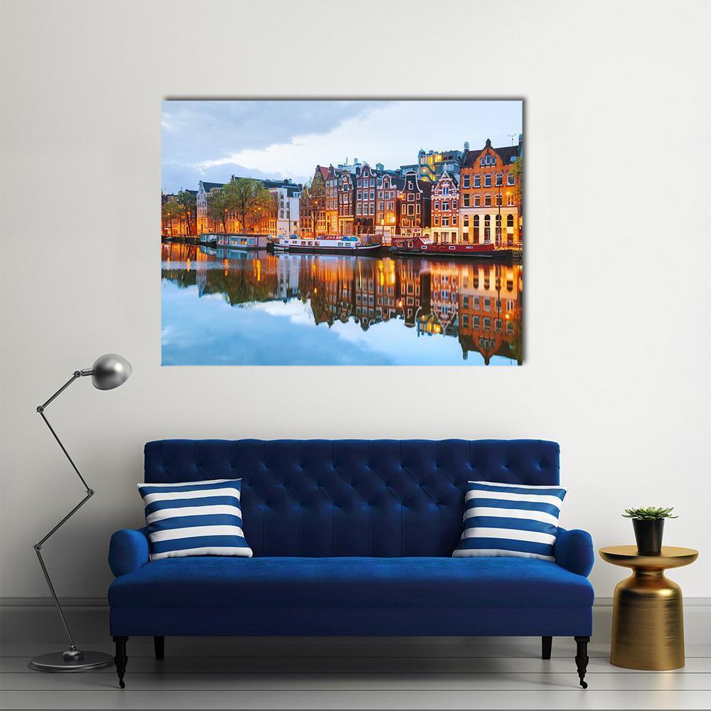 Amstel River and Canal Houses at Night Canvas Wall Art in brown, orange and blue, single panel hung on a wall