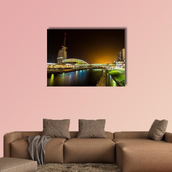 Night Bridge and River in Bremerhaven Canvas Wall Art in black, yellow and blue, single panel hung on a wall