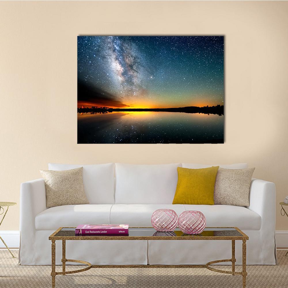 Milky Way Over Sunset Sea Canvas Wall Art in black, orange and blue, single panel hung on a wall