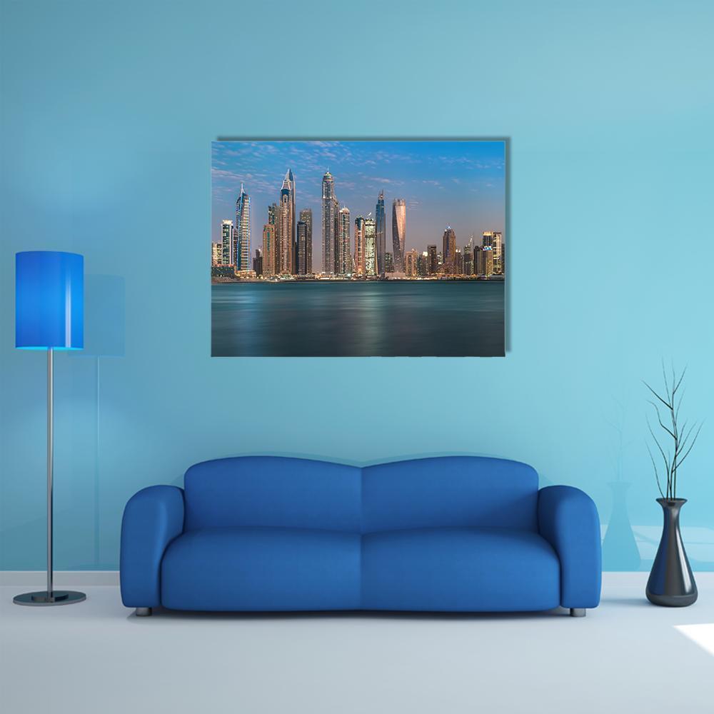 Dubai Jumeirah Beach Night Skyline Canvas Wall Art in gold, blue and navy, single panel hung on a wall