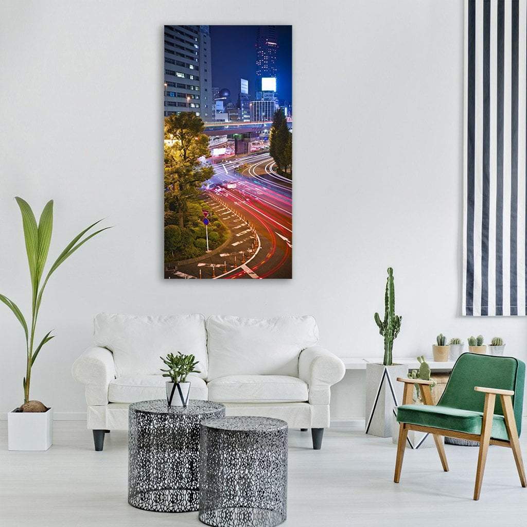 Tokyo Night Highway Light Trails Vertical Canvas Wall Art in black, red and blue, single vertical panel hung on a wall