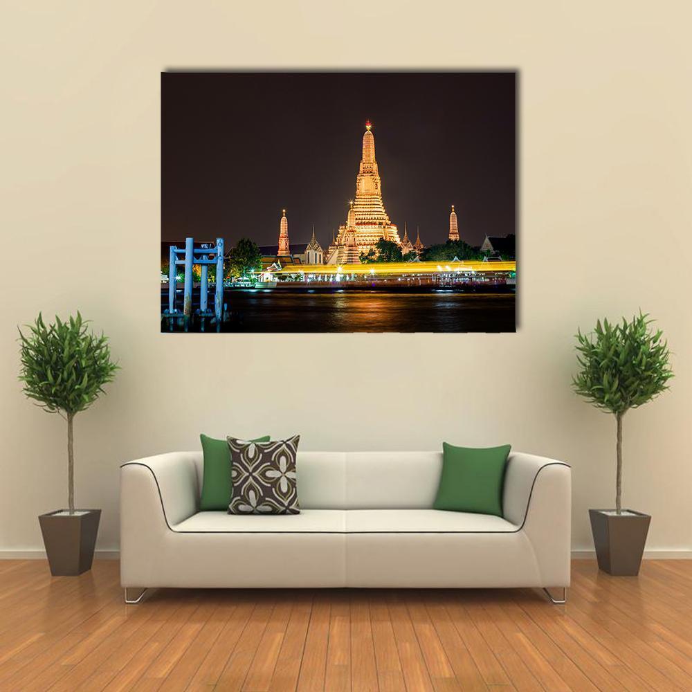 Wat Arun Ratchawararam Temple Night View Canvas Wall Art in black, gold and yellow, single panel hung on a wall