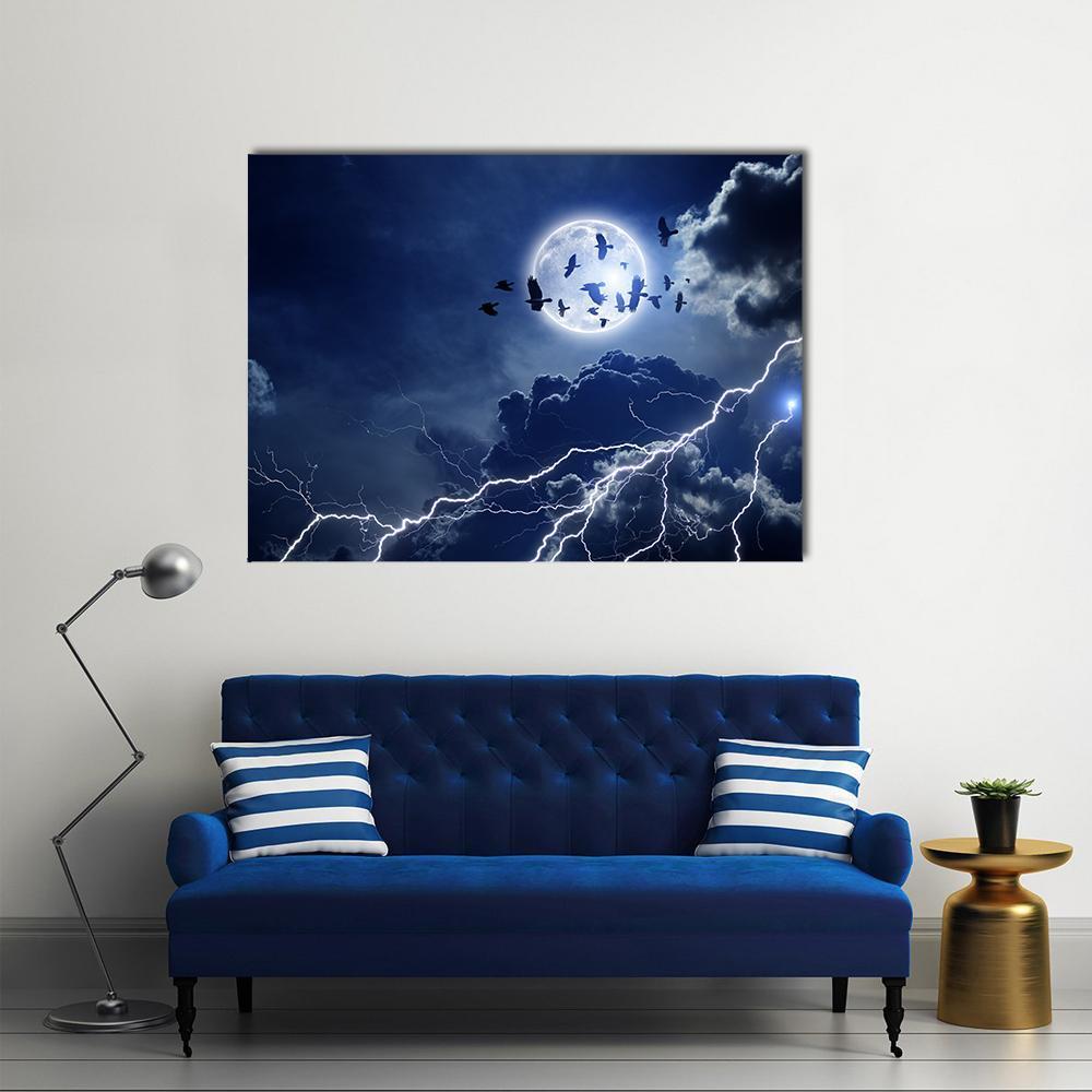 Moon with Lightning and Dark Clouds Canvas Wall Art in black, white and blue, single panel hung on a wall