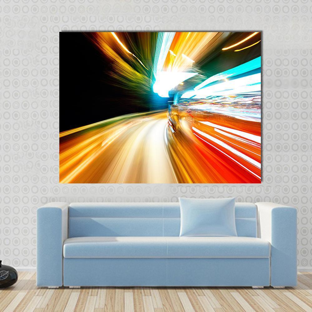 Night Traffic Blur Motion Canvas Wall Art in black, orange and yellow, single panel hung on a wall