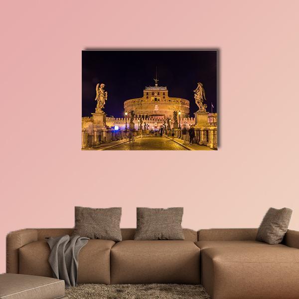 Castel Sant'angelo at Night Canvas Wall Art in black, gold and yellow, single panel hung on a wall