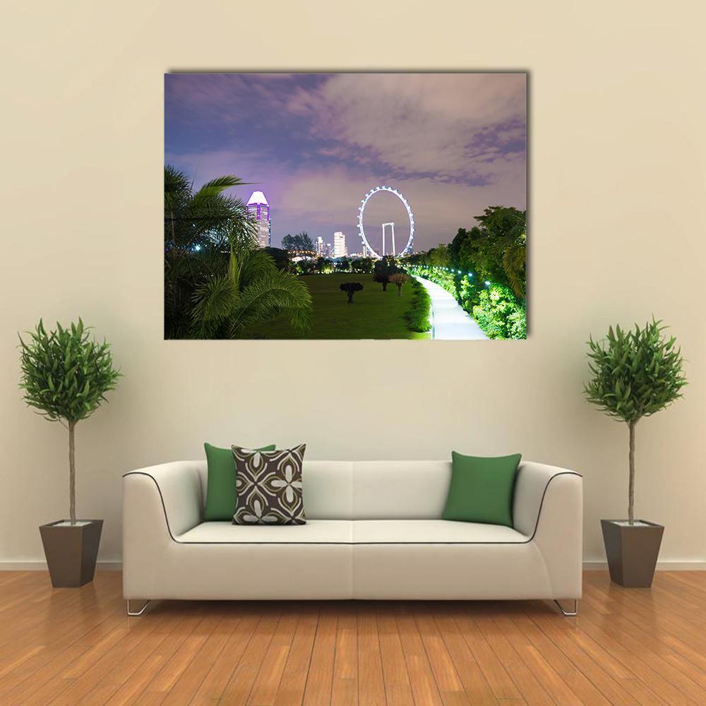 Twilight City Park with Ferris Wheel Canvas Wall Art in green, blue and purple, single panel hung on a wall