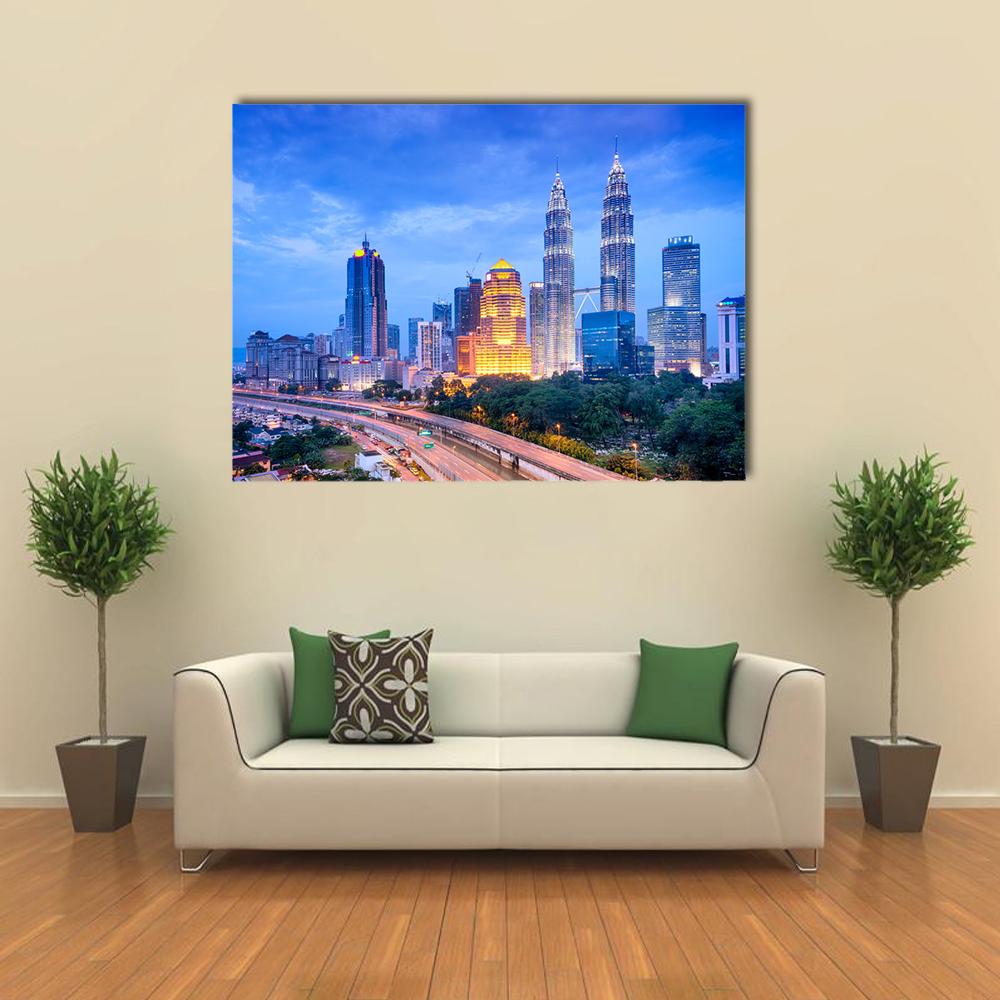 Night View of Kuala Lumpur Canvas Wall Art in black, yellow and blue, single panel hung on a wall