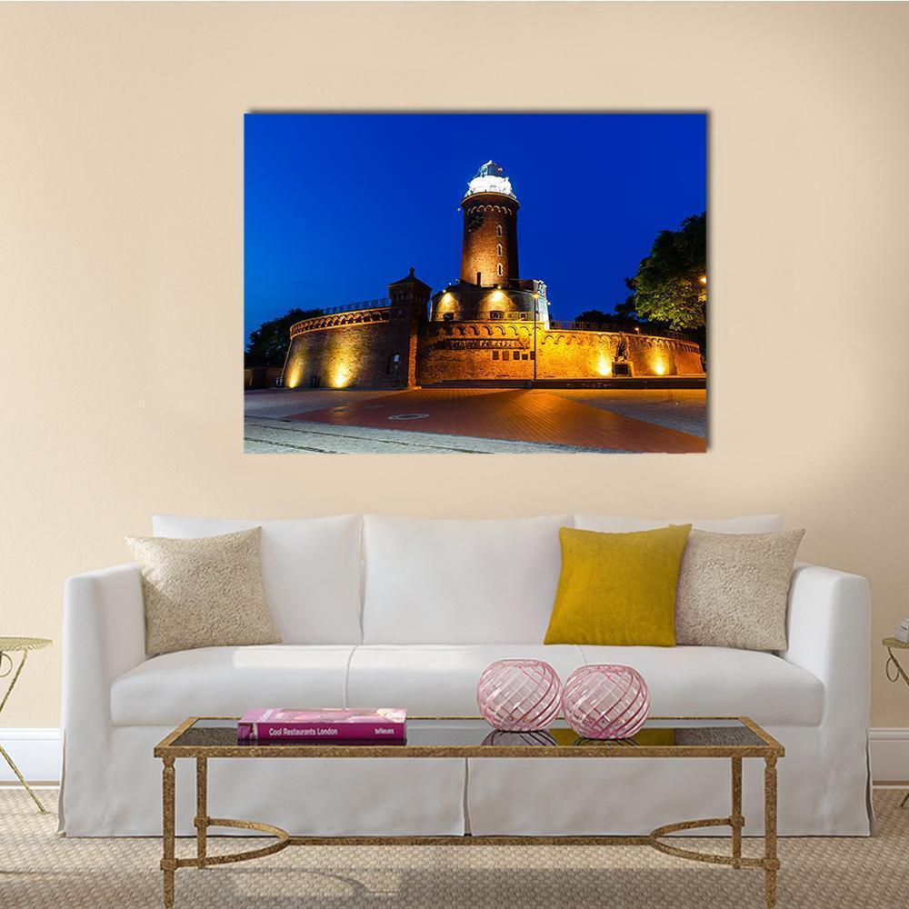 Kolobrzeg Lighthouse at Night Canvas Wall Art in brown, orange and blue, single panel hung on a wall