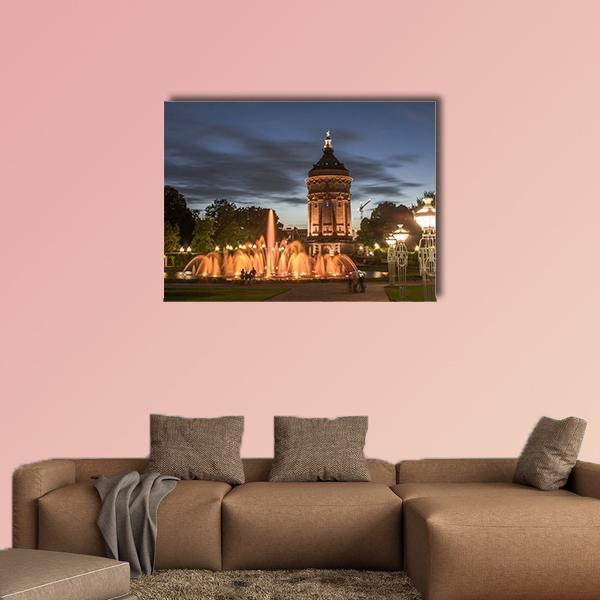 Mannheim Water Tower at Night Canvas Wall Art in black, orange and blue, single panel hung on a wall