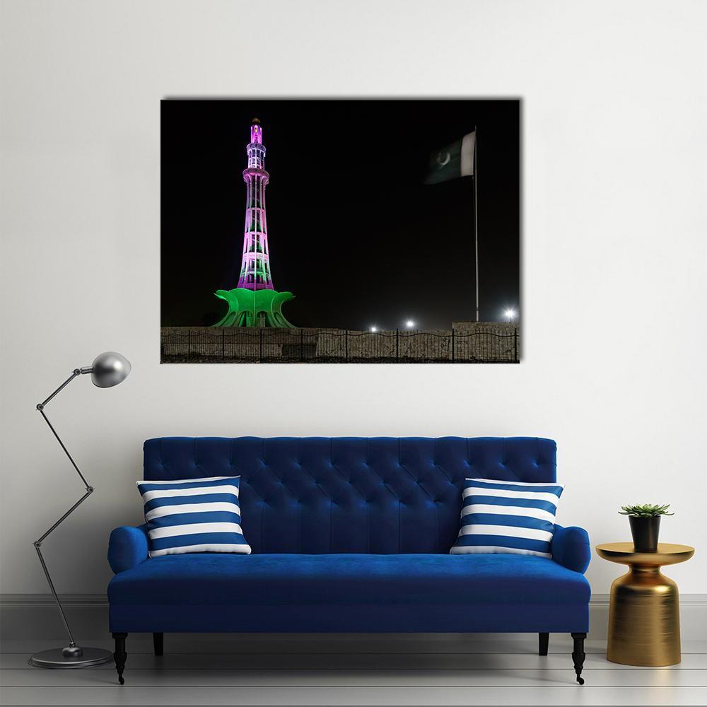 Minar-e-pakistan Illuminated at Night Canvas Wall Art in black, green and purple, single panel hung on a wall