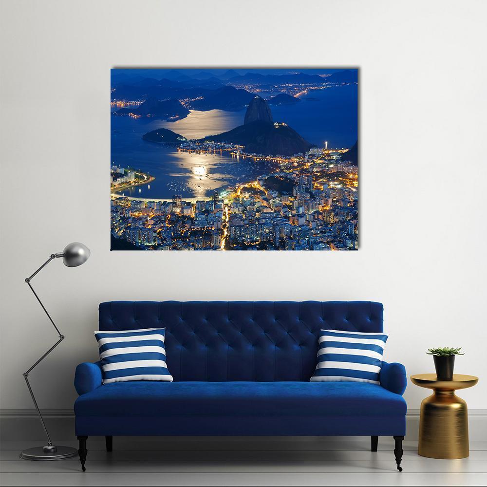 Sugarloaf Mountain at Night Canvas Wall Art in black, yellow and blue, single panel hung on a wall