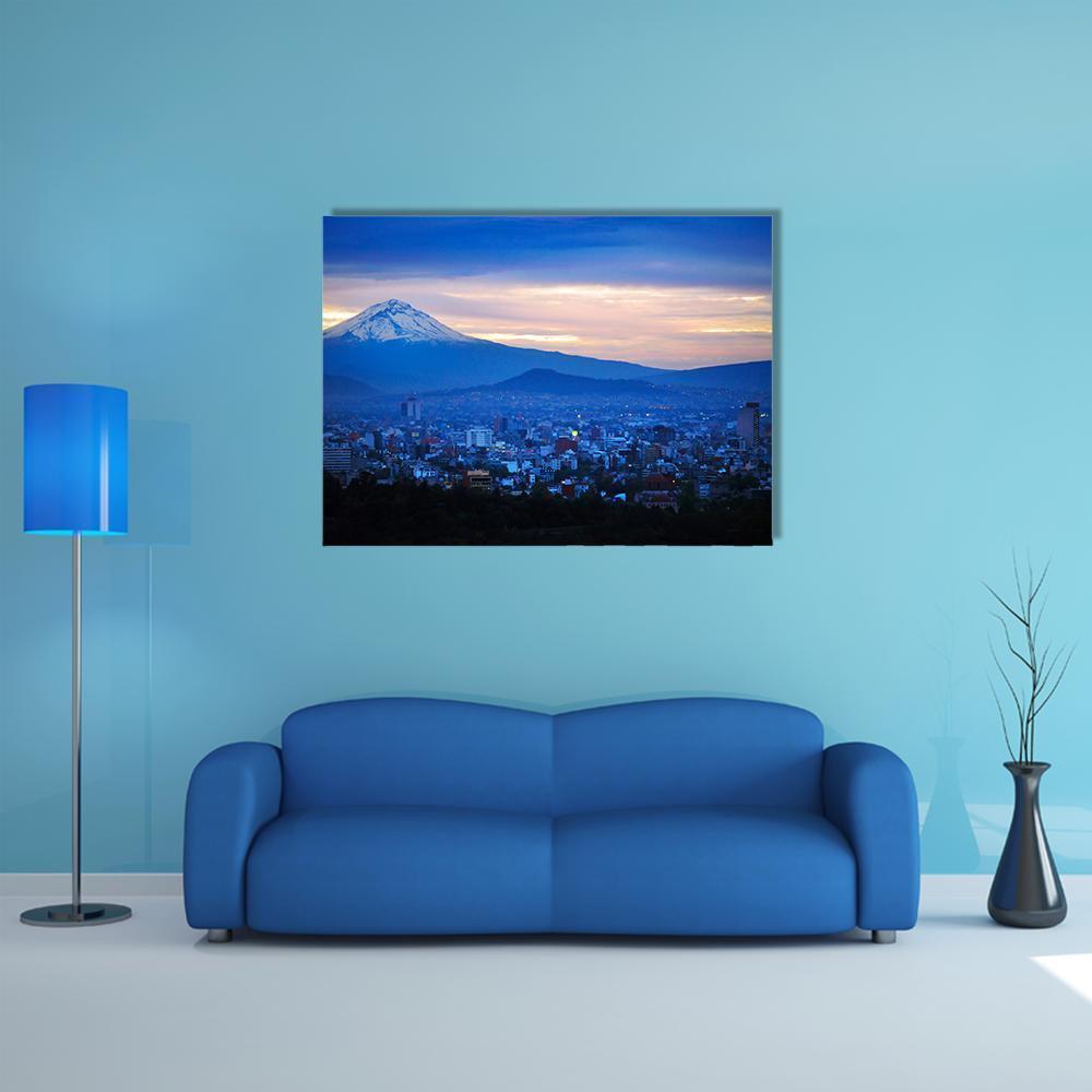 Popocatépetl Volcano at Dusk Canvas Wall Art in orange, blue and purple, single panel hung on a wall