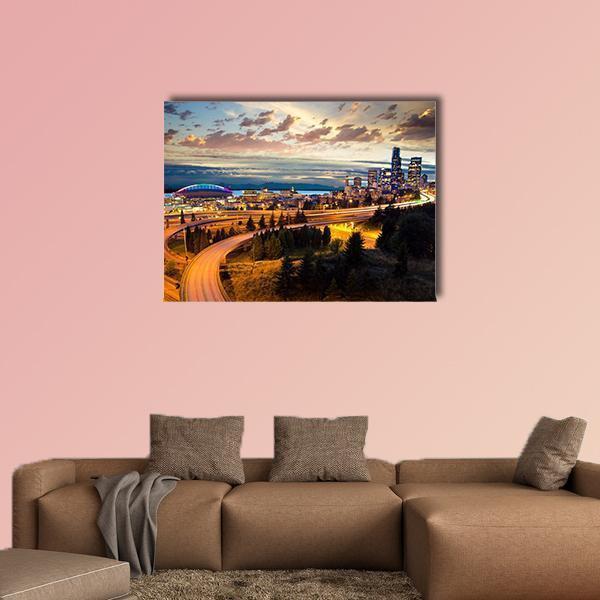 Seattle Night Skyline with Light Trails Canvas Wall Art in orange, yellow and blue, single panel hung on a wall