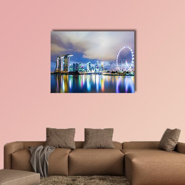 Singapore Skyline at Night Canvas Wall Art in yellow, blue and purple, single panel hung on a wall