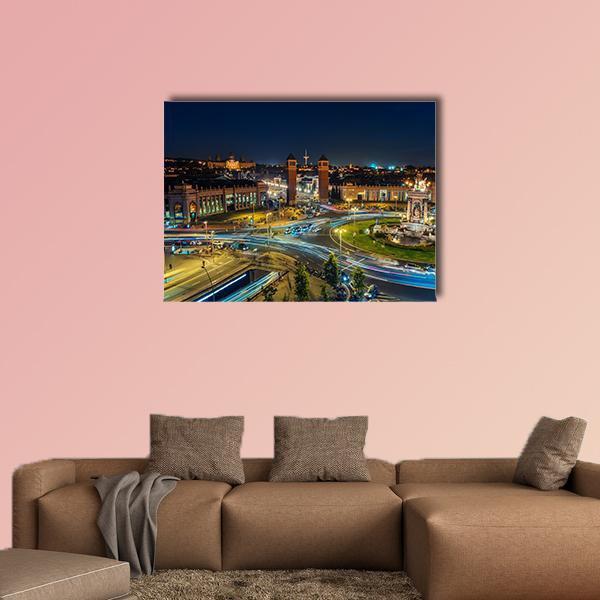 Plaza Espanya at Night Canvas Wall Art in black, yellow and blue, single panel hung on a wall
