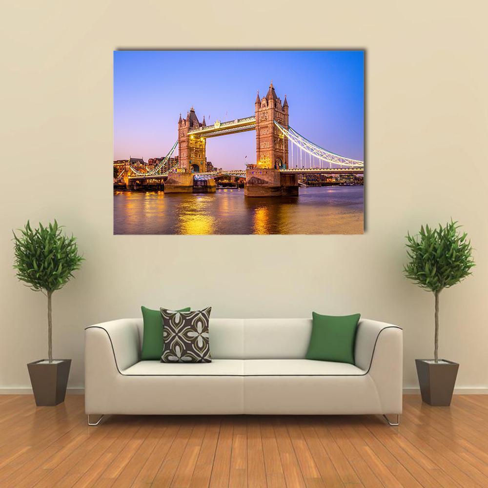 Tower Bridge at Night Canvas Wall Art in gold, yellow and blue, single panel hung on a wall