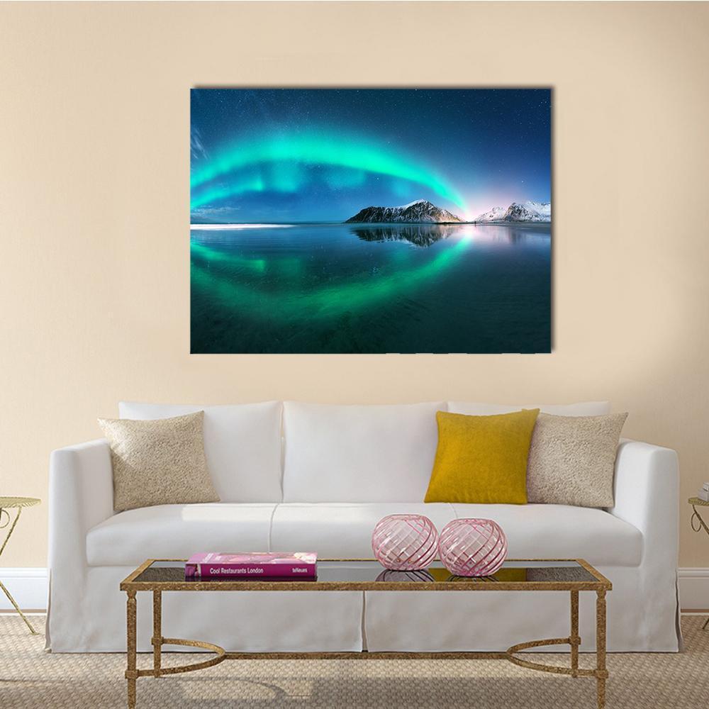 Aurora Over Snow-capped Mountains Canvas Wall Art in green, blue and navy, single panel hung on a wall