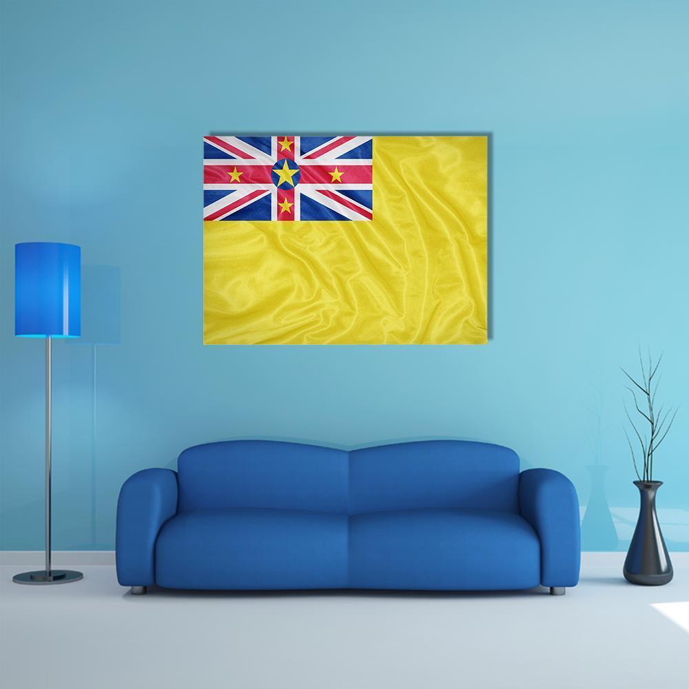 Waving Niue Flag Canvas Wall Art in red, yellow and blue, single panel hung on a wall