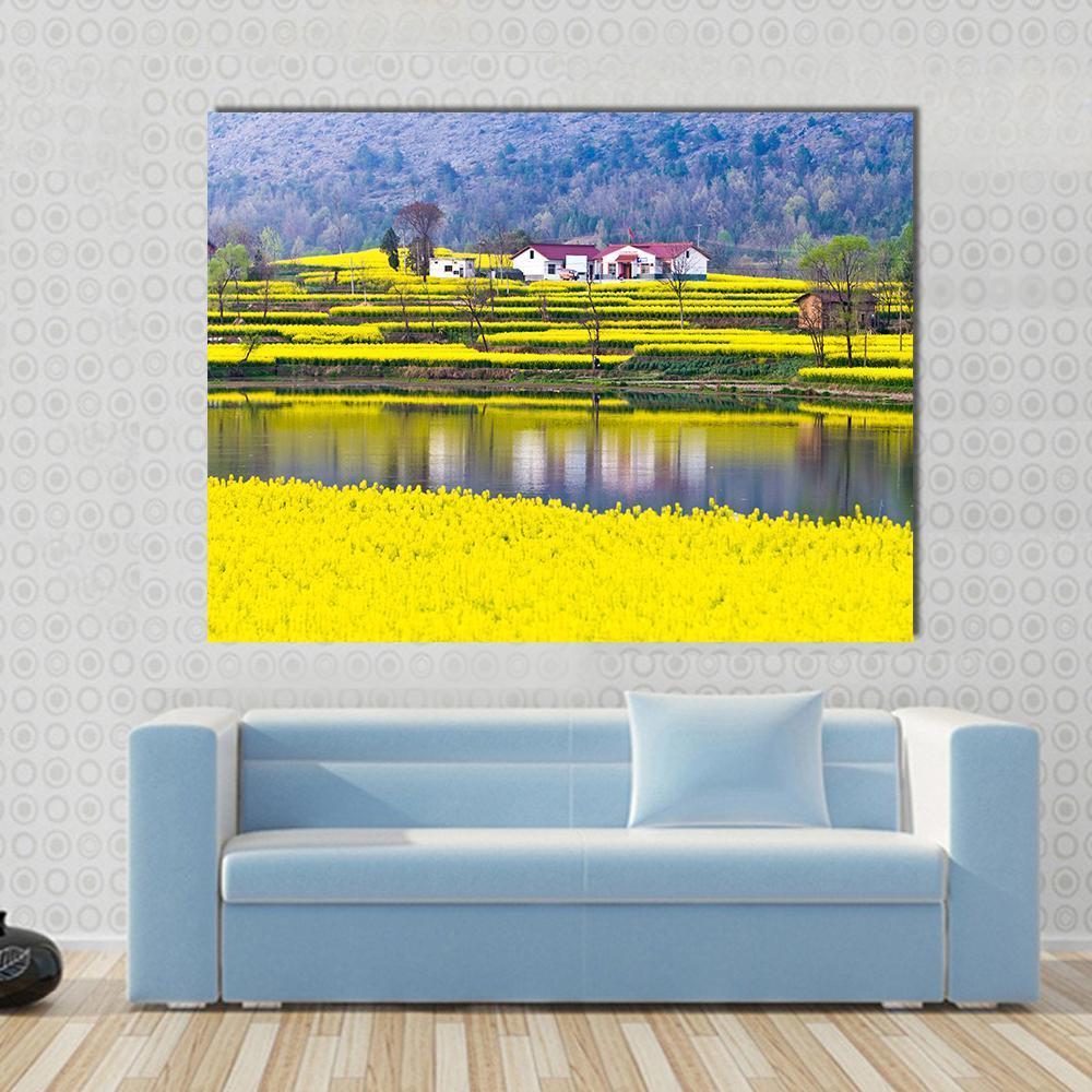 Rural Spring Scenery Canvas Wall Art in yellow, green and blue, single panel hung on a wall